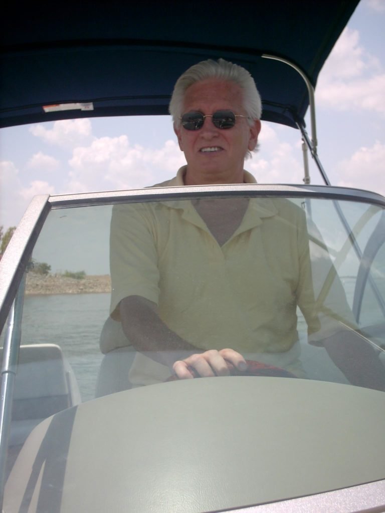 Lloyd Sherman, HSV Board of Director Election Candidate Mans the Helm for smooth cruising ahead as he steers his boat into clearer waters.