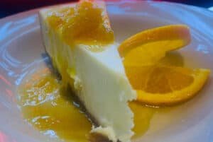New York Style Cheesecake Topped With a Warm Orange Brandy Sauce & Tanner's Bar & Grill